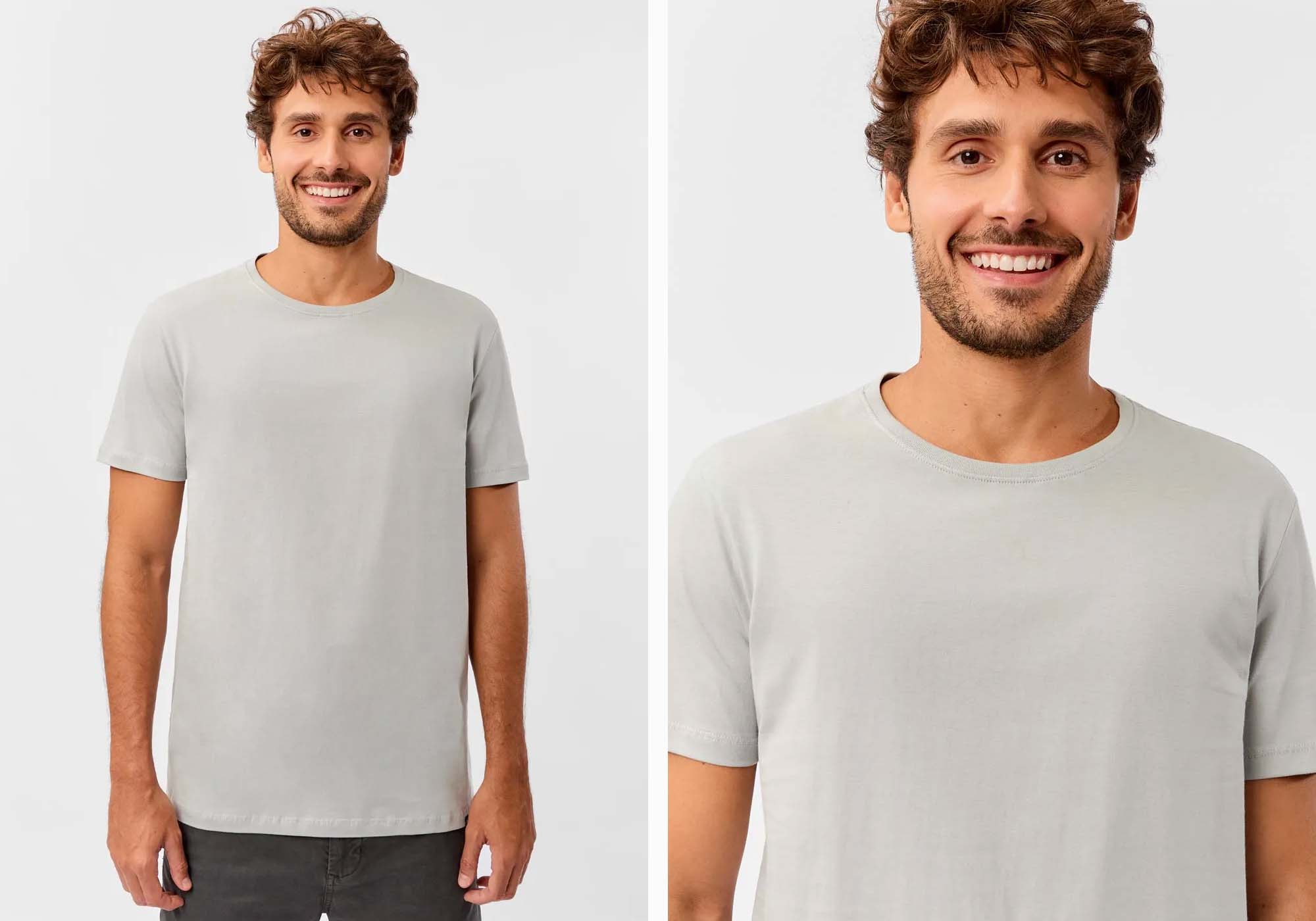 Homem sorridente usando camiseta cinza