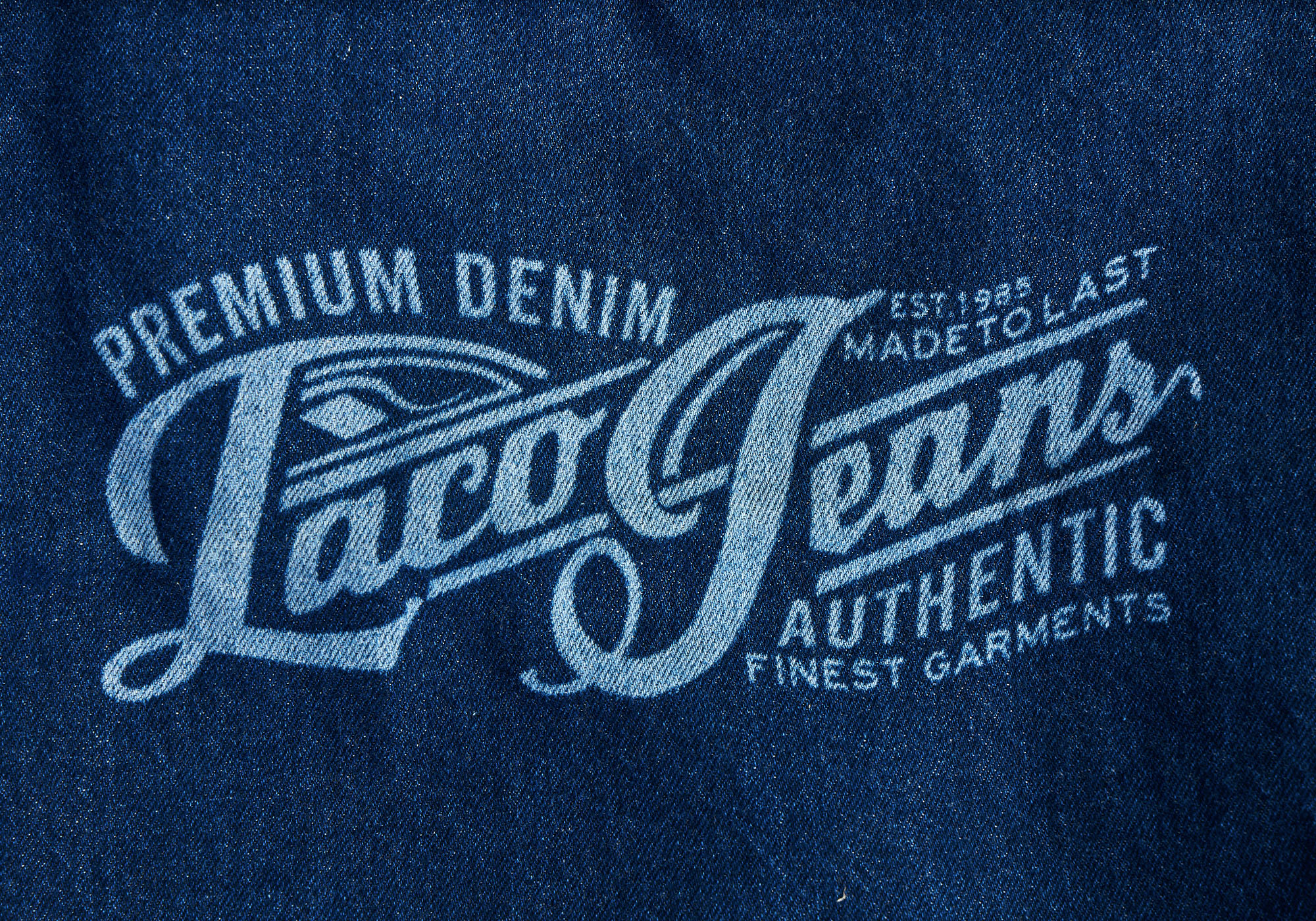 Logo da marca Taco Jeans em tecido denim